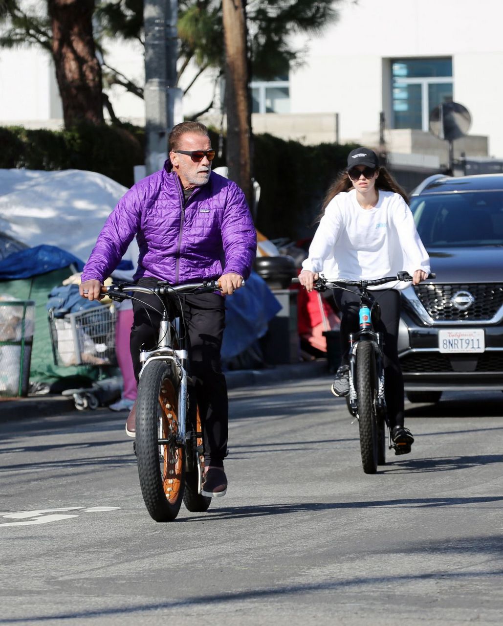 Christina And Arnold Schwarzenegger Out Riding Bikes Los Angeles