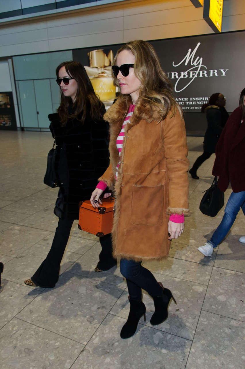 Dakota Johnson Arrives Heathrow Airport London