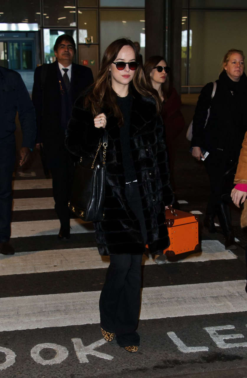 Dakota Johnson Arrives Heathrow Airport London