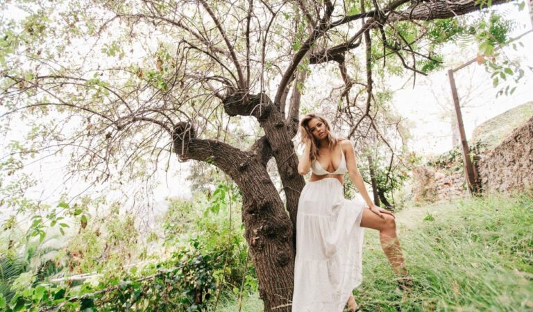 Debby Ryan Presenting Her Tits Next To A Tree (1 photo)