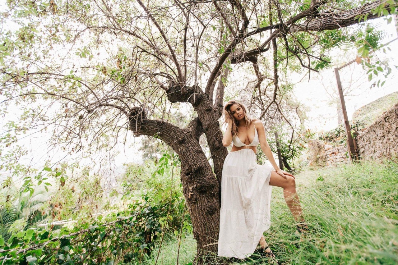 Debby Ryan Presenting Her Tits Next To A Tree