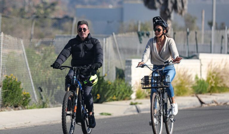 Lauren Silverman And Simon Cowell Riding Bikes Out Malibu (6 photos)