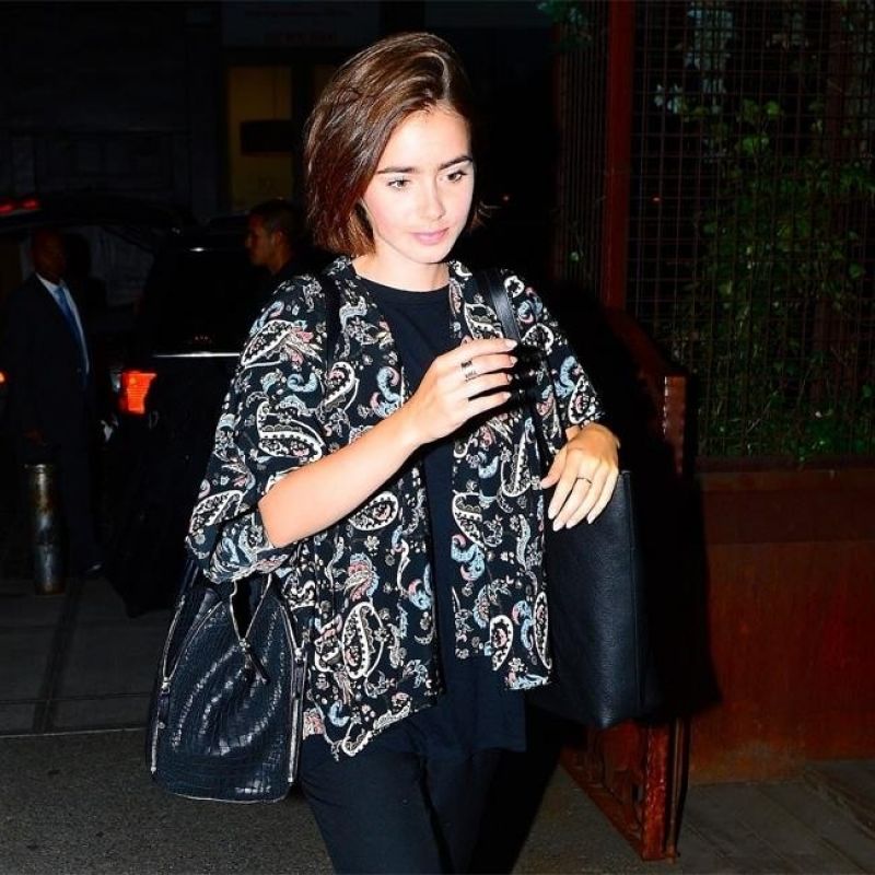Lily Collins Leaves Her Hotel New York