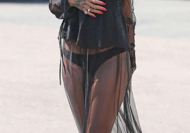 Rihanna Racy Sheer Skirt Airport France (15 photos)
