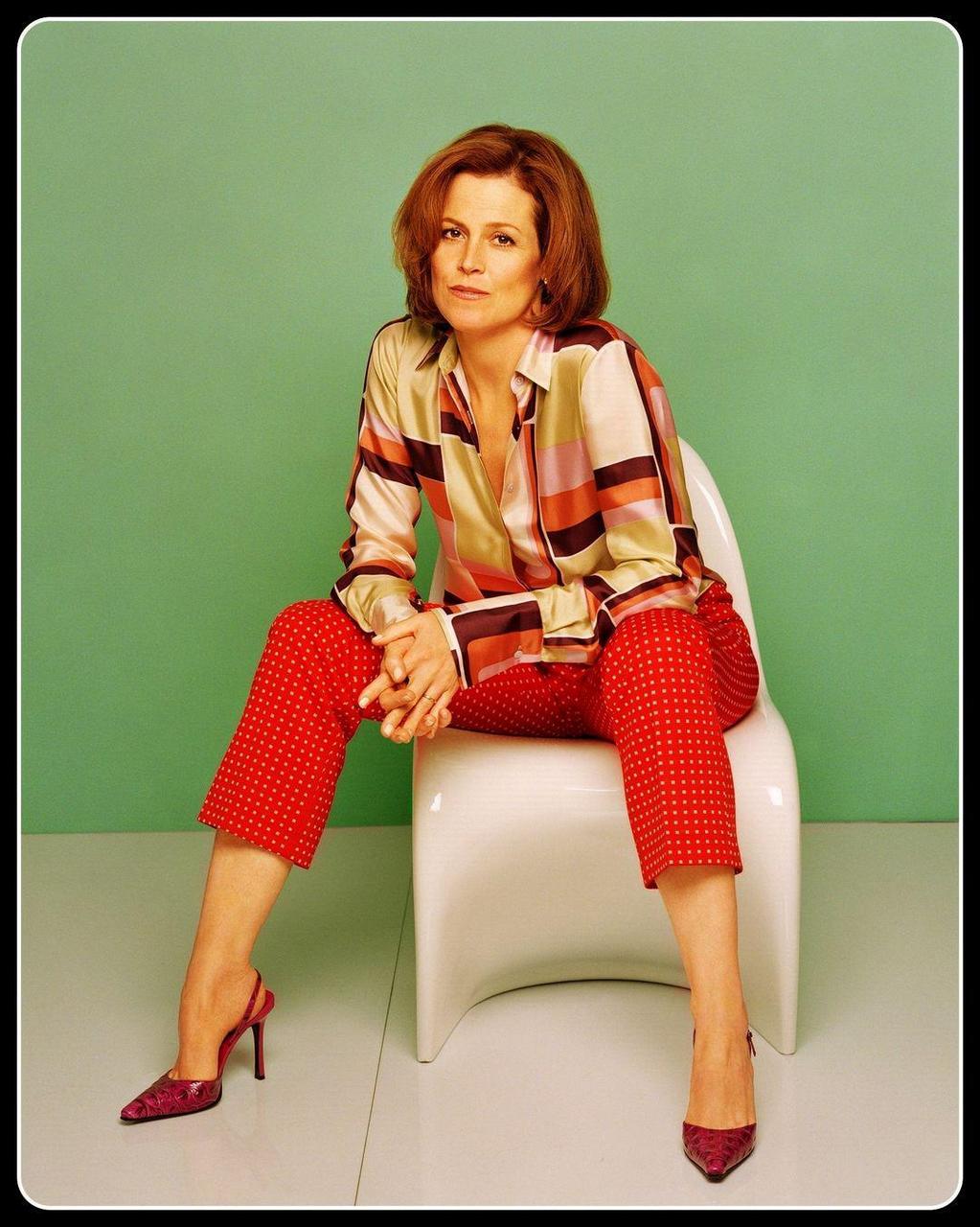 Sigourney Weaver Siting In A Chair Hot